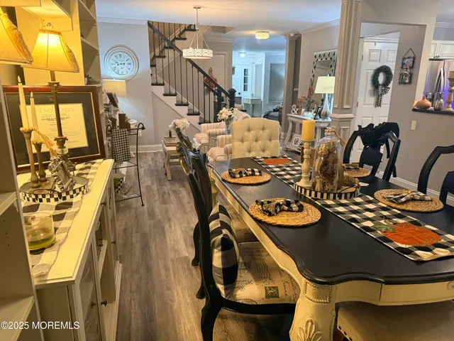 a kitchen with stainless steel appliances kitchen island granite countertop a refrigerator and a stove top oven