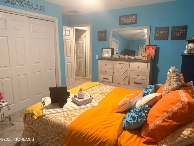 a view of a livingroom with furniture wooden floor and staircase