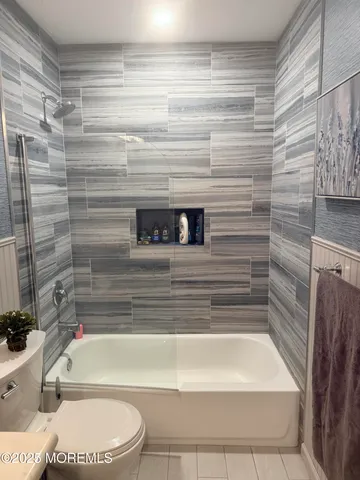 a view of a livingroom with furniture and a potted plant