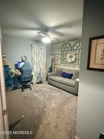 a view of walk in closet with clothes