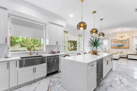 a kitchen with a sink and stove