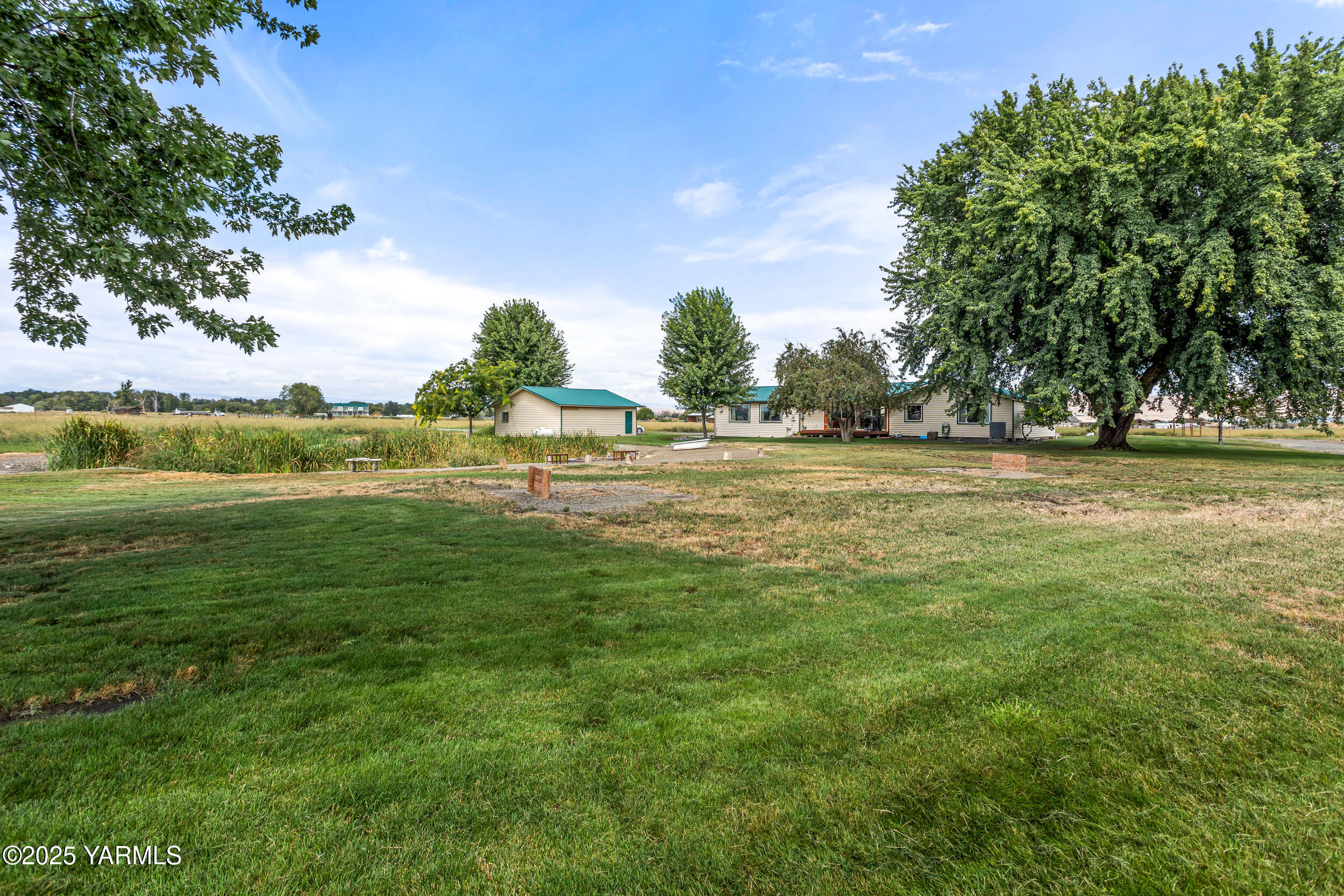 2715 Riverside Road Yakima, WA 98901 - Photo 29 of 35 a view of a field with an trees in the background