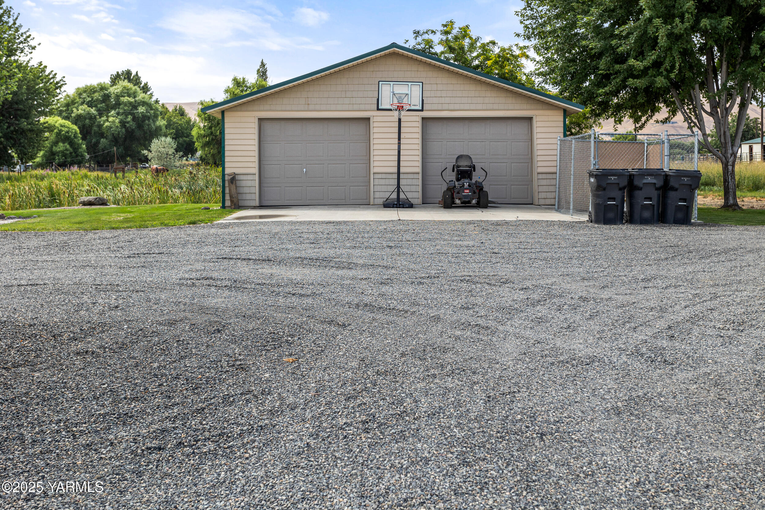 2715 Riverside Road Yakima, WA 98901 - Photo 7 of 35 a view of a house with backyard and trees