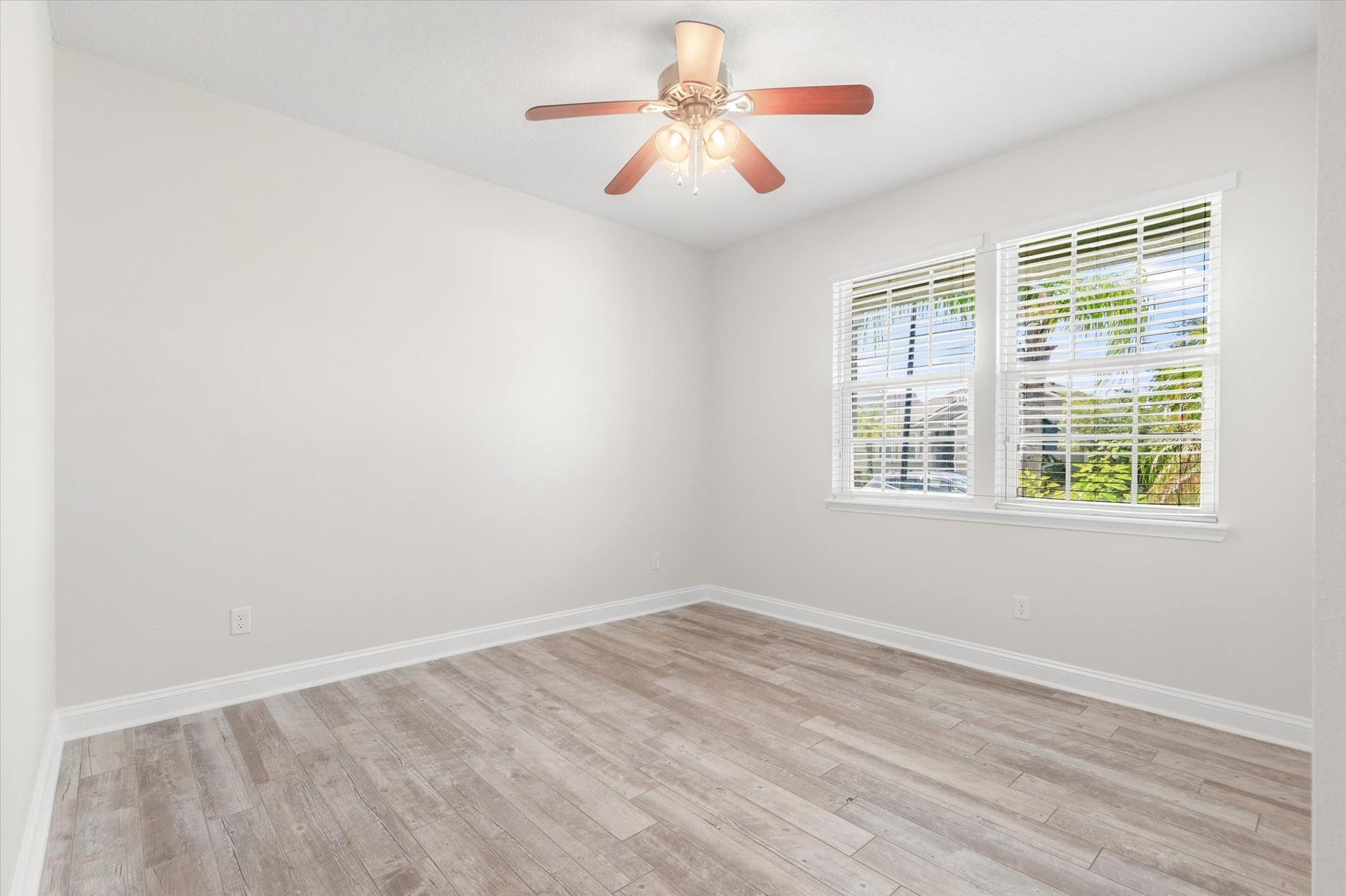 70 Quartz Place St. Augustine, FL 32086 - Photo 24 of 78 a view of a room with a ceiling fan and a window