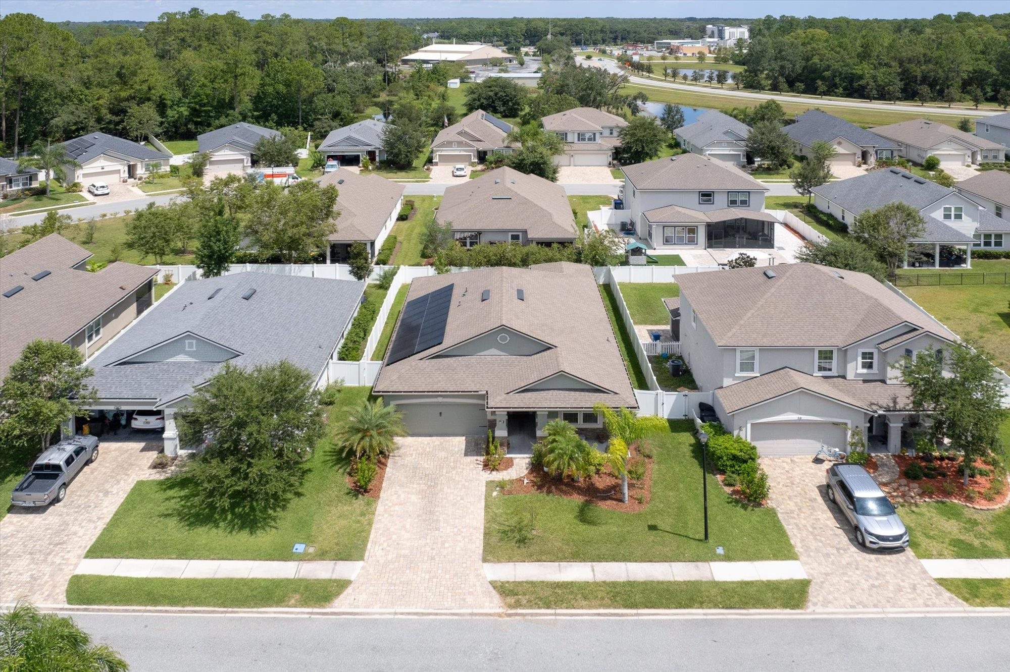 70 Quartz Place St. Augustine, FL 32086 - Photo 40 of 78 an aerial view of multiple houses with a yard