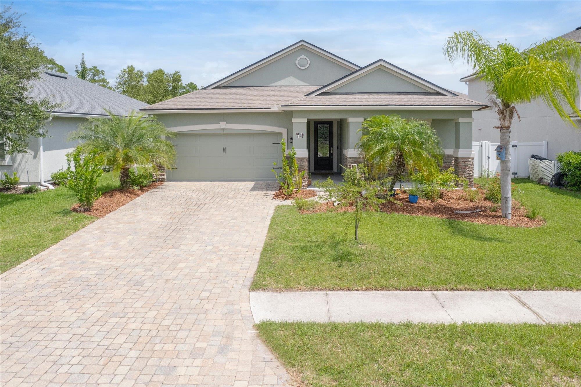 70 Quartz Place St. Augustine, FL 32086 - Photo 42 of 78 a front view of a house with a yard and porch