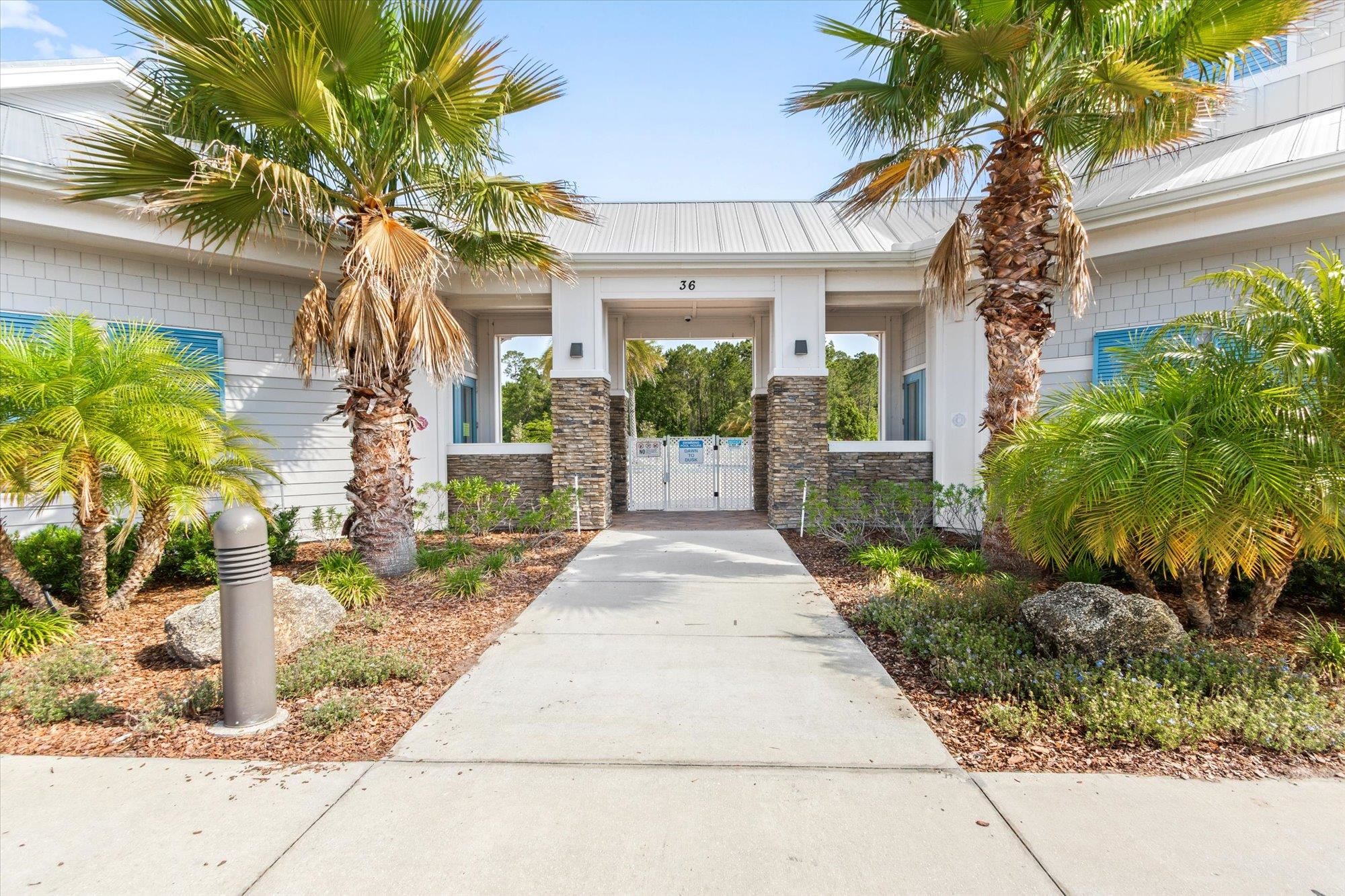 70 Quartz Place St. Augustine, FL 32086 - Photo 66 of 78 a front view of a house with a garden