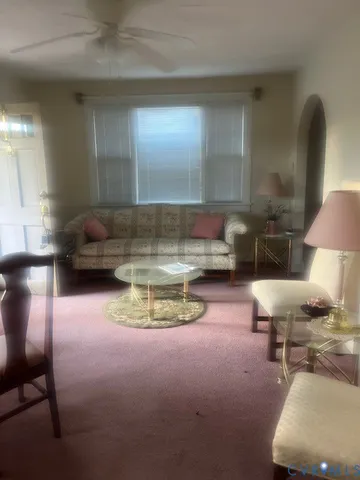 a room with furniture and a lamp