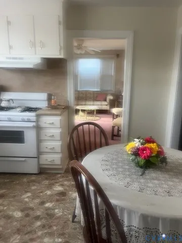a kitchen with a stove and cabinets