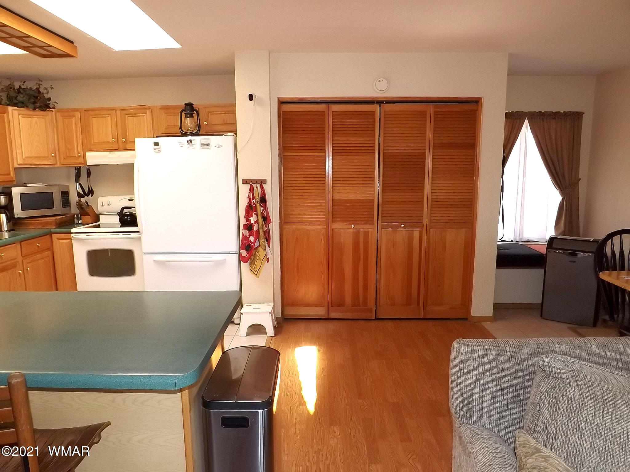 2064 Lumber Valley Road Overgaard, AZ 85933 - Photo 27 of 44 a kitchen with a refrigerator and a sink