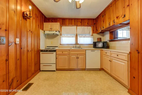 a view of a entryway with wooden walls