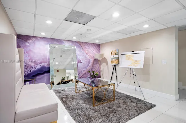 a view of a swimming pool with a patio and a garden