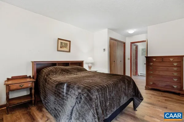 a bedroom with a bed and a view of bedroom