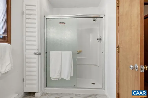 a bathroom with a toilet a sink and a mirror