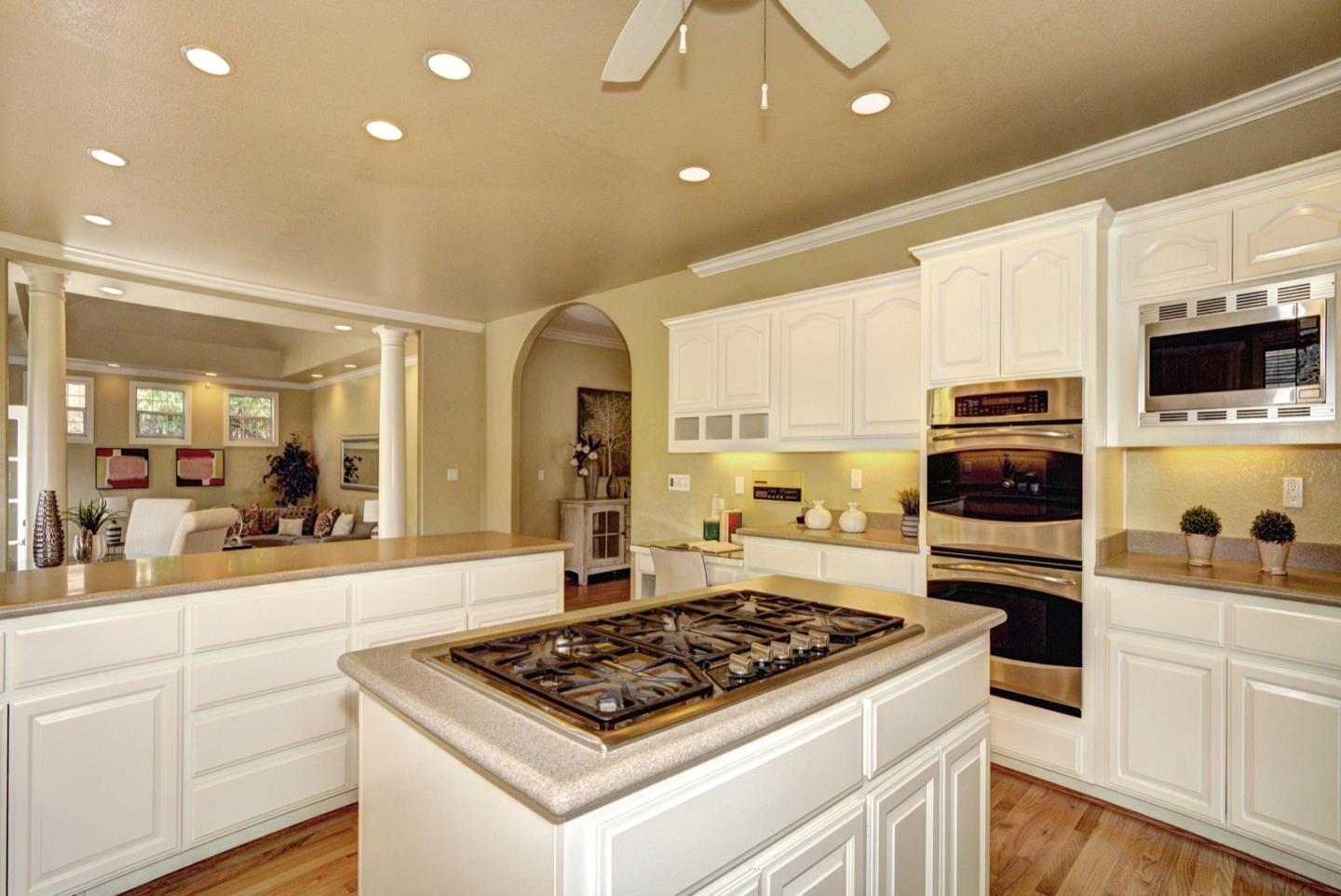 10171 Carmen Road Cupertino, CA 95014 - Photo 14 of 42 a kitchen with a stove and a refrigerator