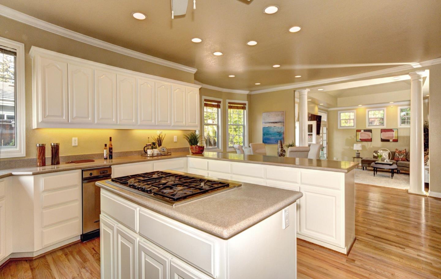 10171 Carmen Road Cupertino, CA 95014 - Photo 17 of 42 a kitchen with a stove a sink and cabinets