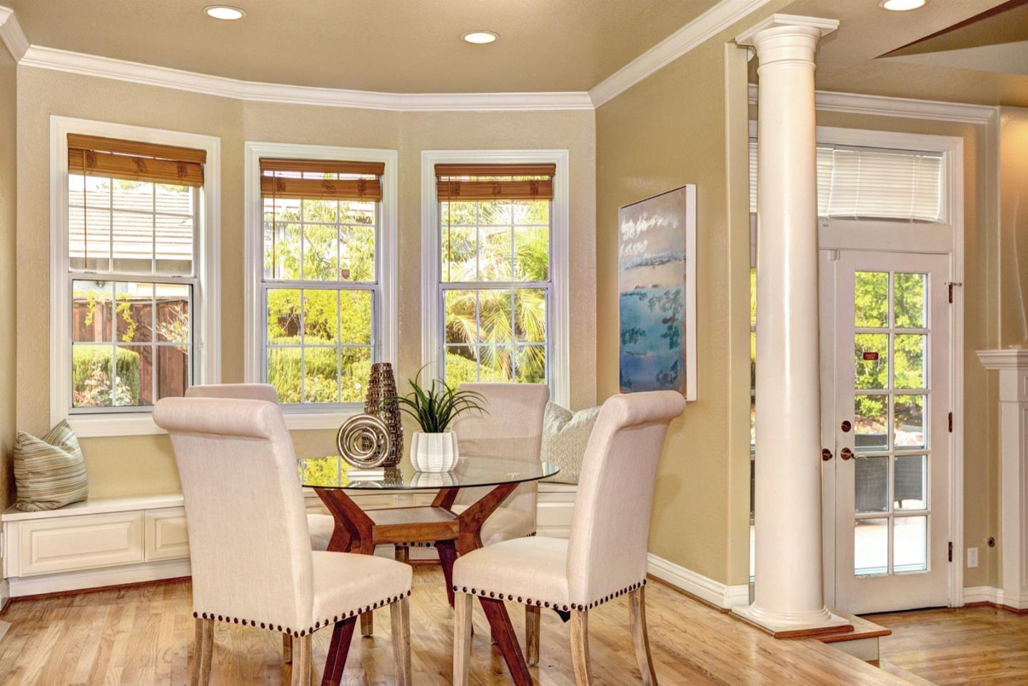 10171 Carmen Road Cupertino, CA 95014 - Photo 18 of 42 a view of a dining room with furniture and wooden floor