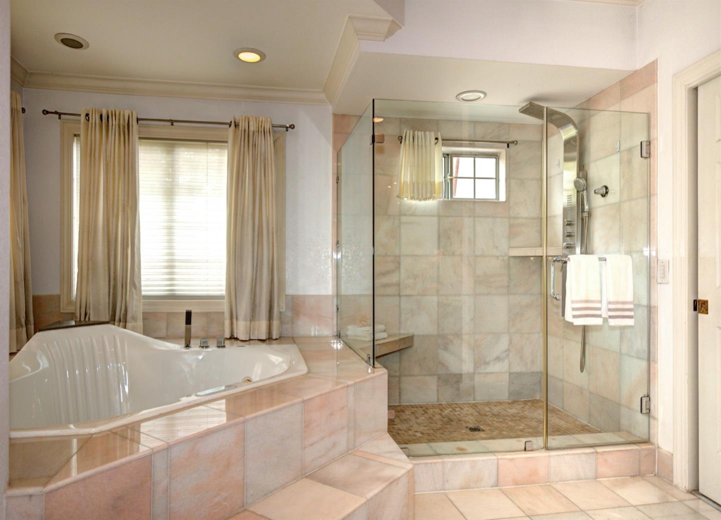 10171 Carmen Road Cupertino, CA 95014 - Photo 28 of 42 a spacious bathroom with a shower and a bathtub