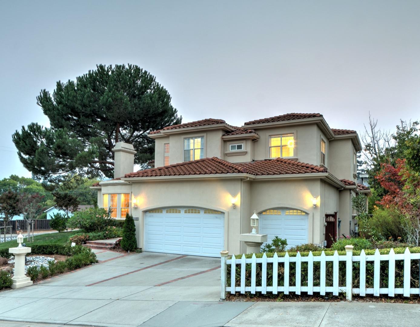 10171 Carmen Road Cupertino, CA 95014 - Photo 3 of 42 a front view of a house with a yard and outdoor seating
