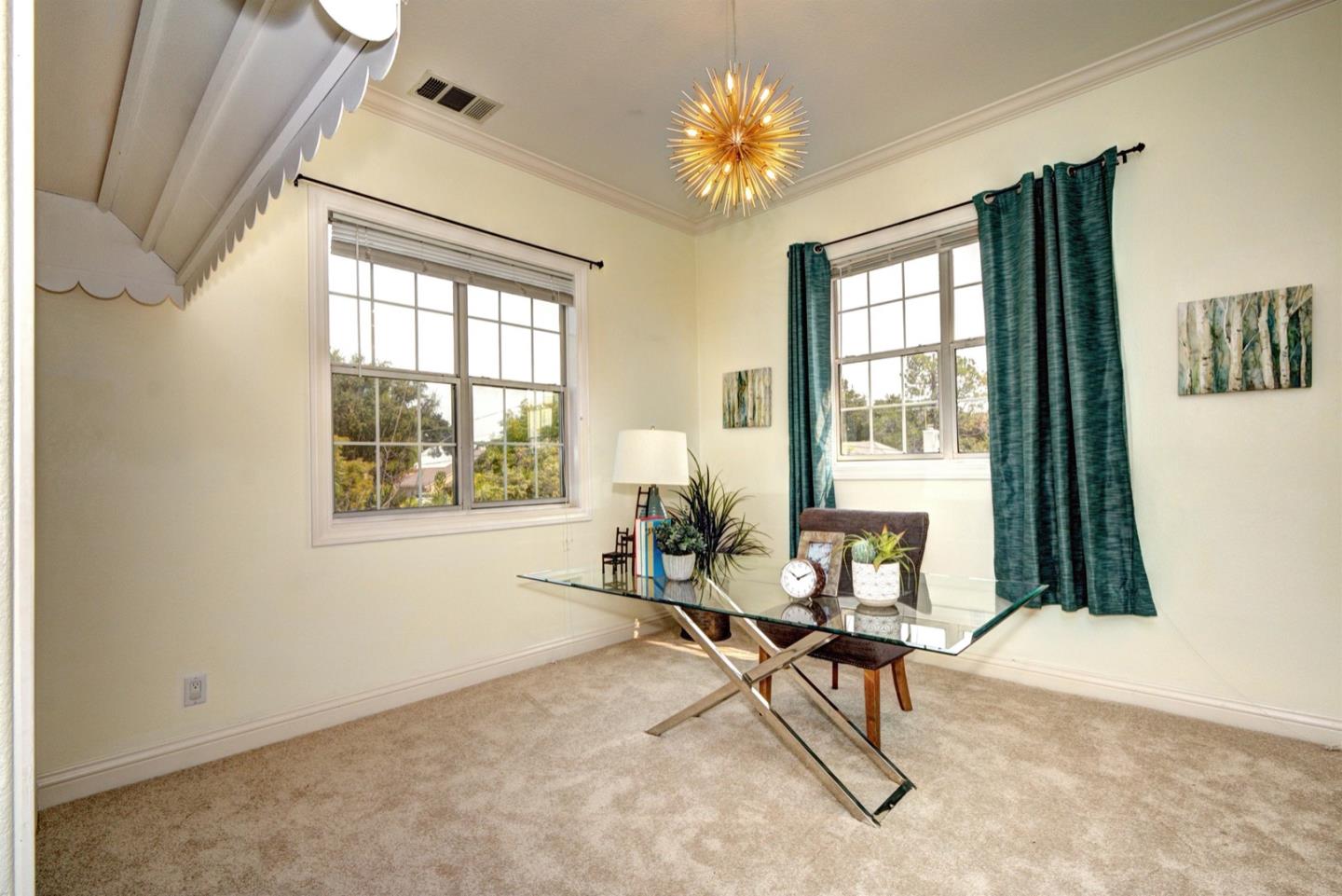 10171 Carmen Road Cupertino, CA 95014 - Photo 32 of 42 a living room with furniture and a window