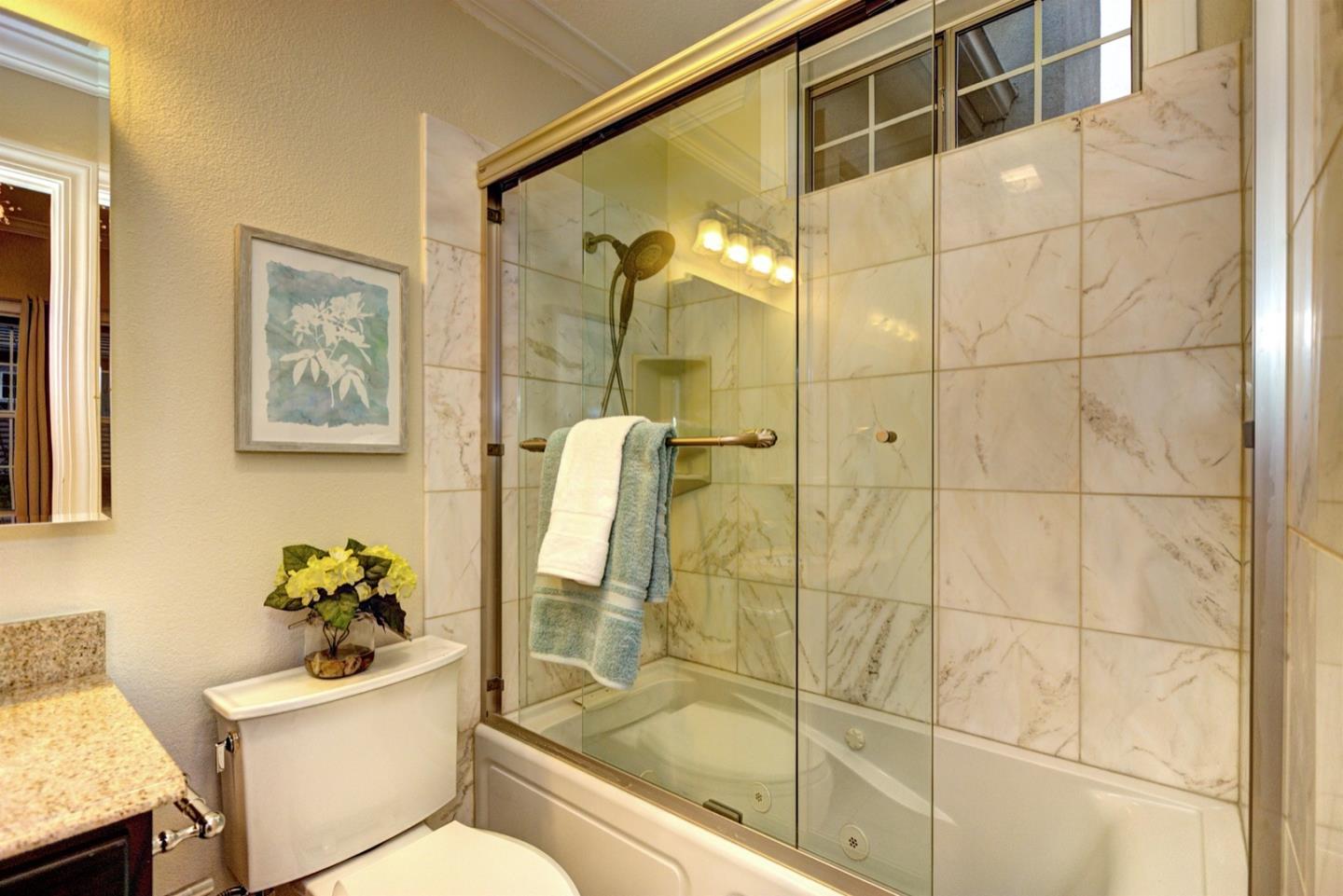 10171 Carmen Road Cupertino, CA 95014 - Photo 35 of 42 a bathroom with a shower a toilet and sink