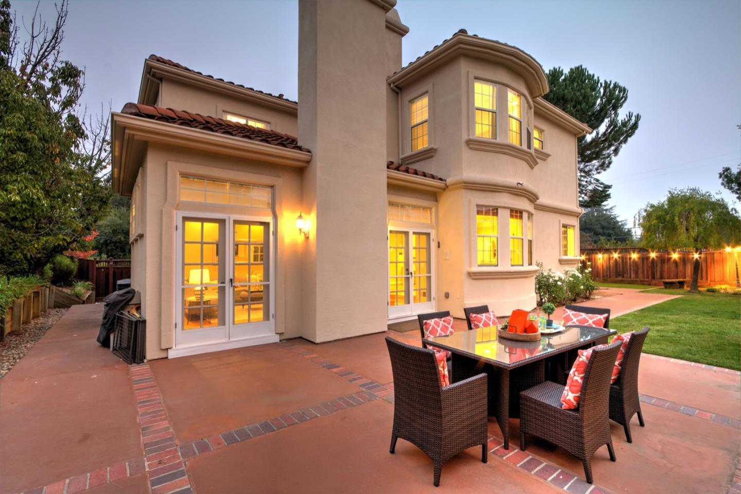 10171 Carmen Road Cupertino, CA 95014 - Photo 40 of 42 a dining room with a wooden table and chairs