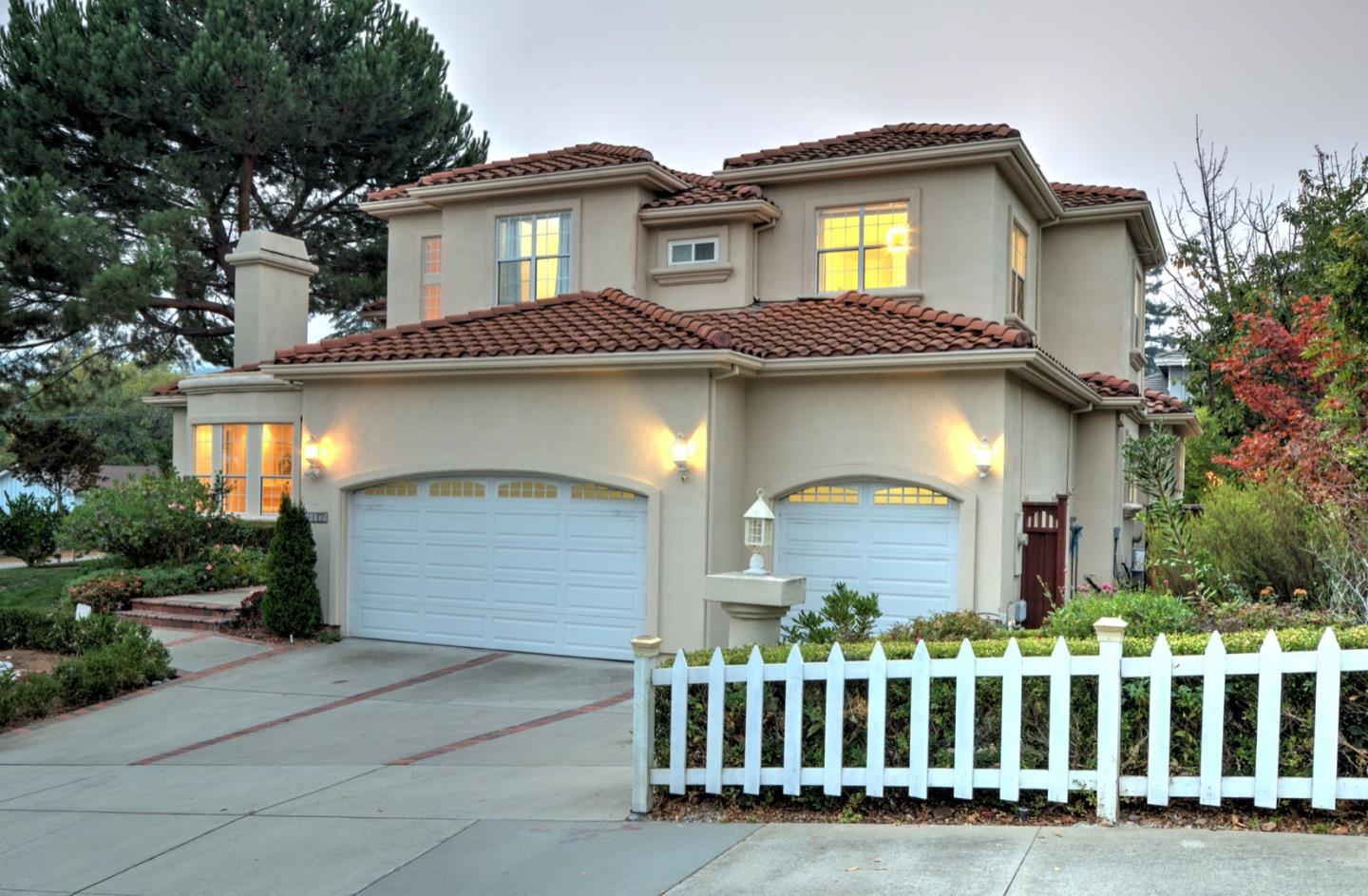 10171 Carmen Road Cupertino, CA 95014 - Photo 4 of 42 a front view of a house with a porch