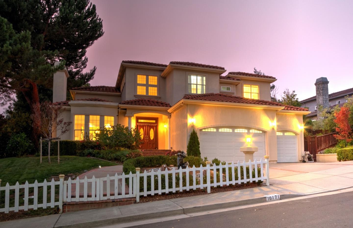 10171 Carmen Road Cupertino, CA 95014 - Photo 6 of 42 a front view of a house with a garden