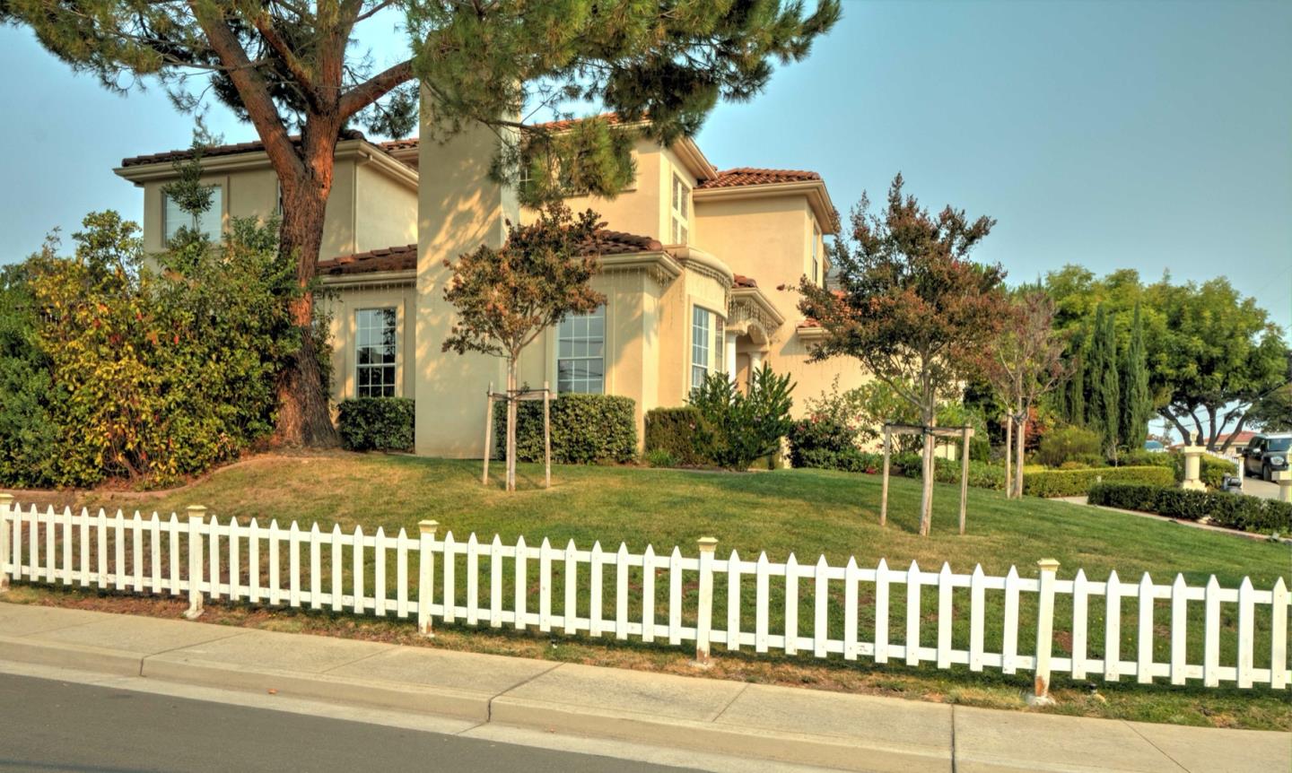 10171 Carmen Road Cupertino, CA 95014 - Photo 7 of 42 a view of a house with a yard