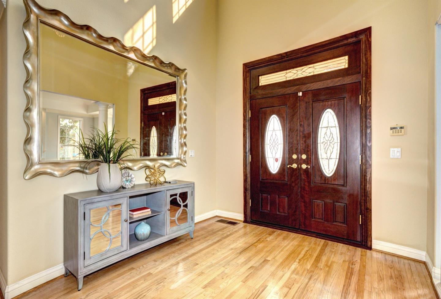 10171 Carmen Road Cupertino, CA 95014 - Photo 9 of 42 a view of living room and mirror