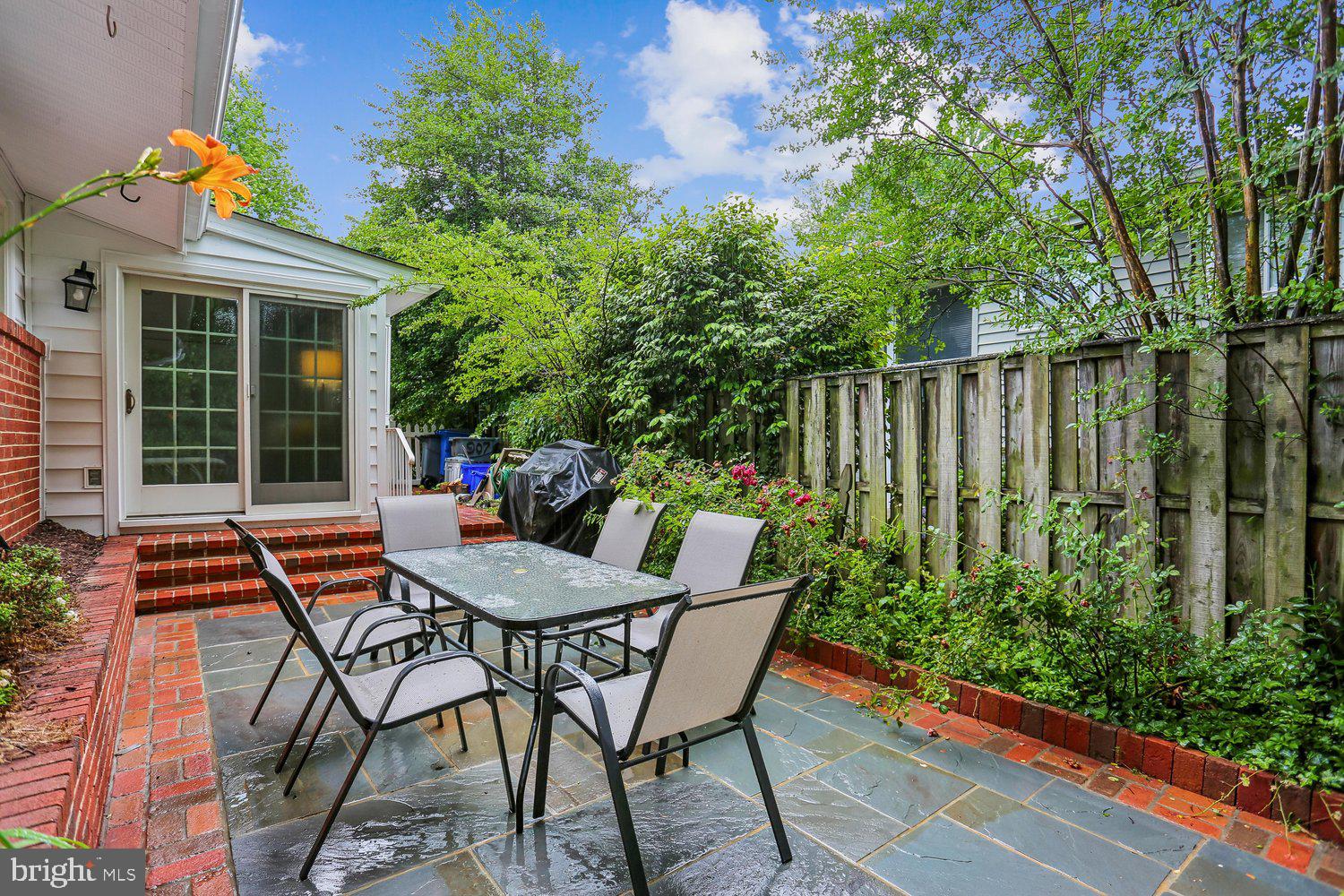 907 Hoyt Street Silver Spring, MD 20902 - Photo 60 of 69 a view of a chairs and table in the patio with potted plants