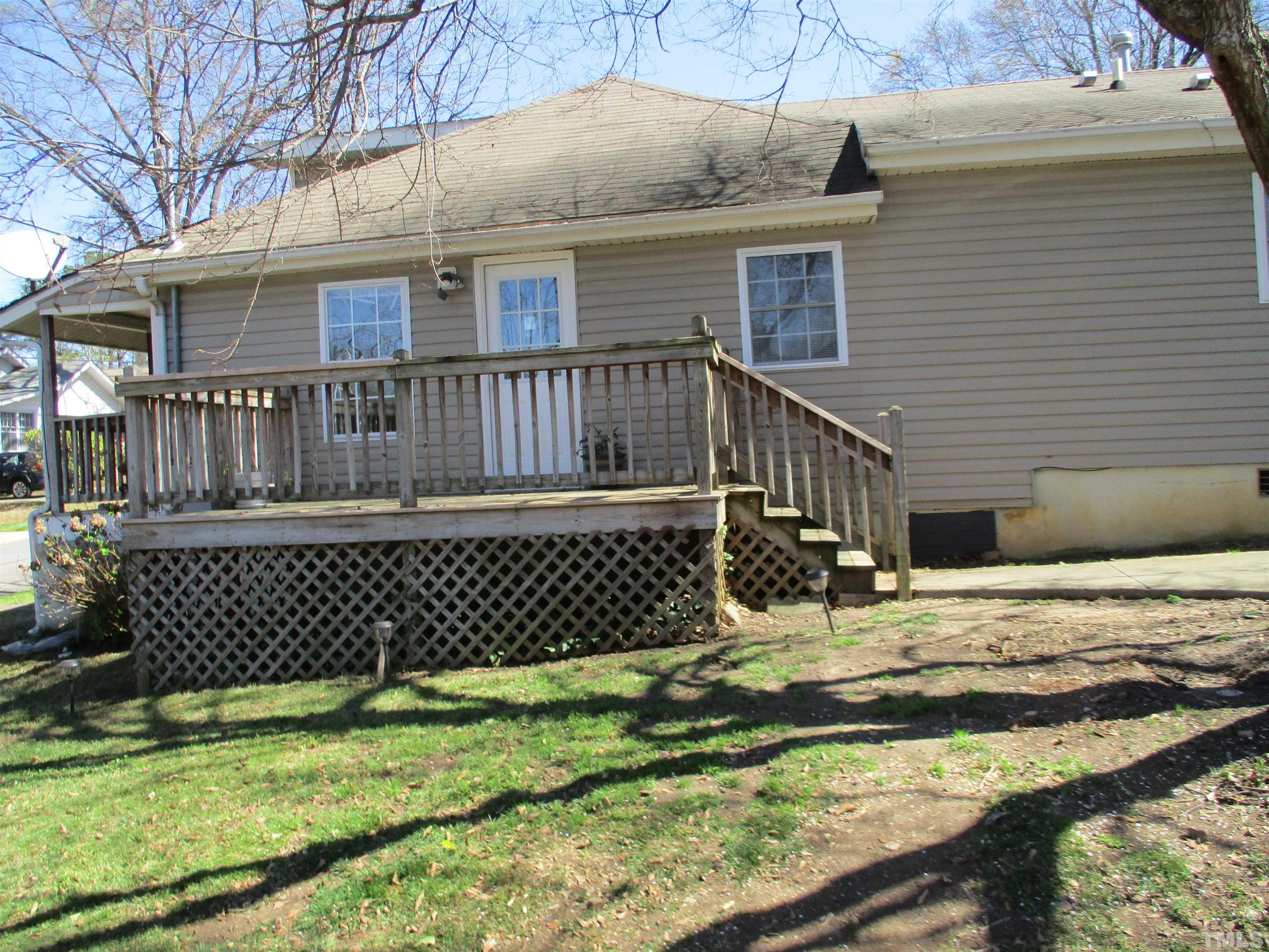 2415 Bedford Avenue Raleigh, NC 27607 - Photo 2 of 12 a view of a house with a yard