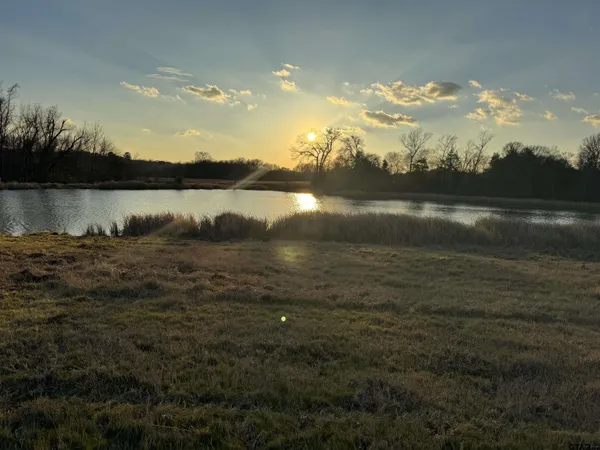 an aerial view of valley and lake