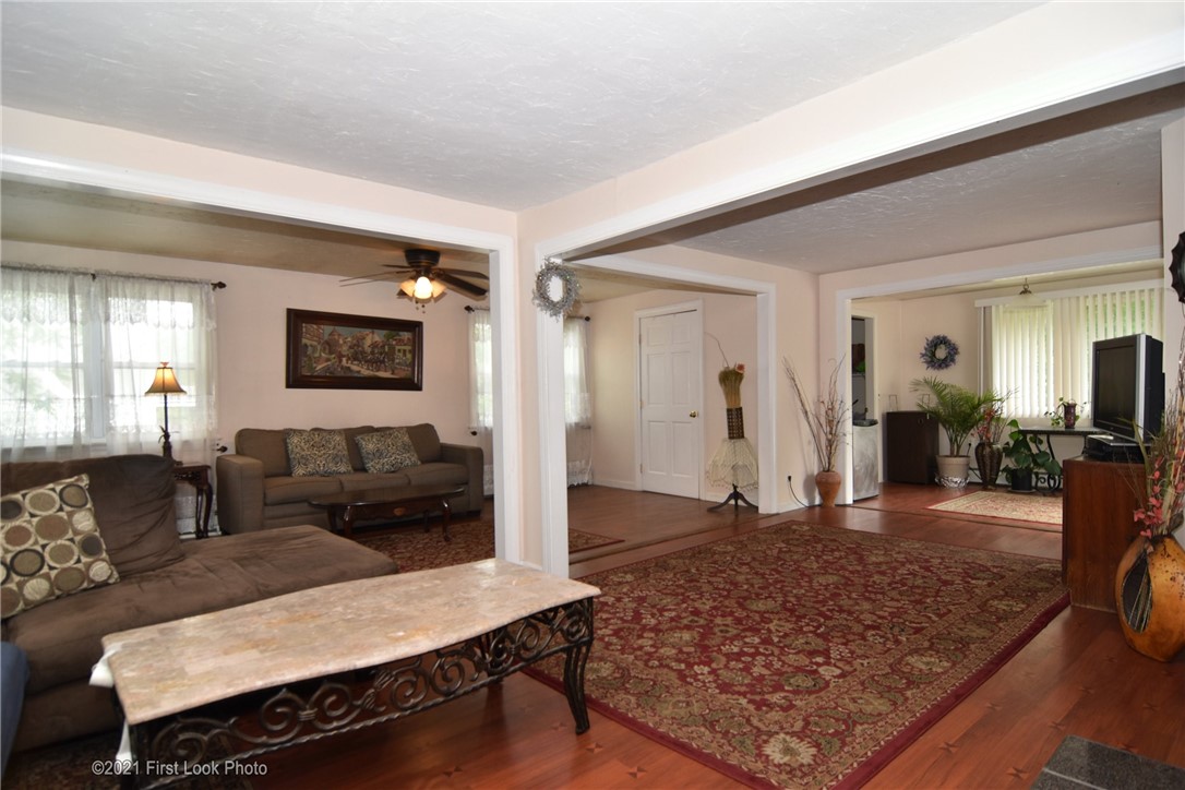 107 Bonnet Shores Road Narragansett, RI 02882 - Photo 13 of 33 Spacious double living room with a sunroom.