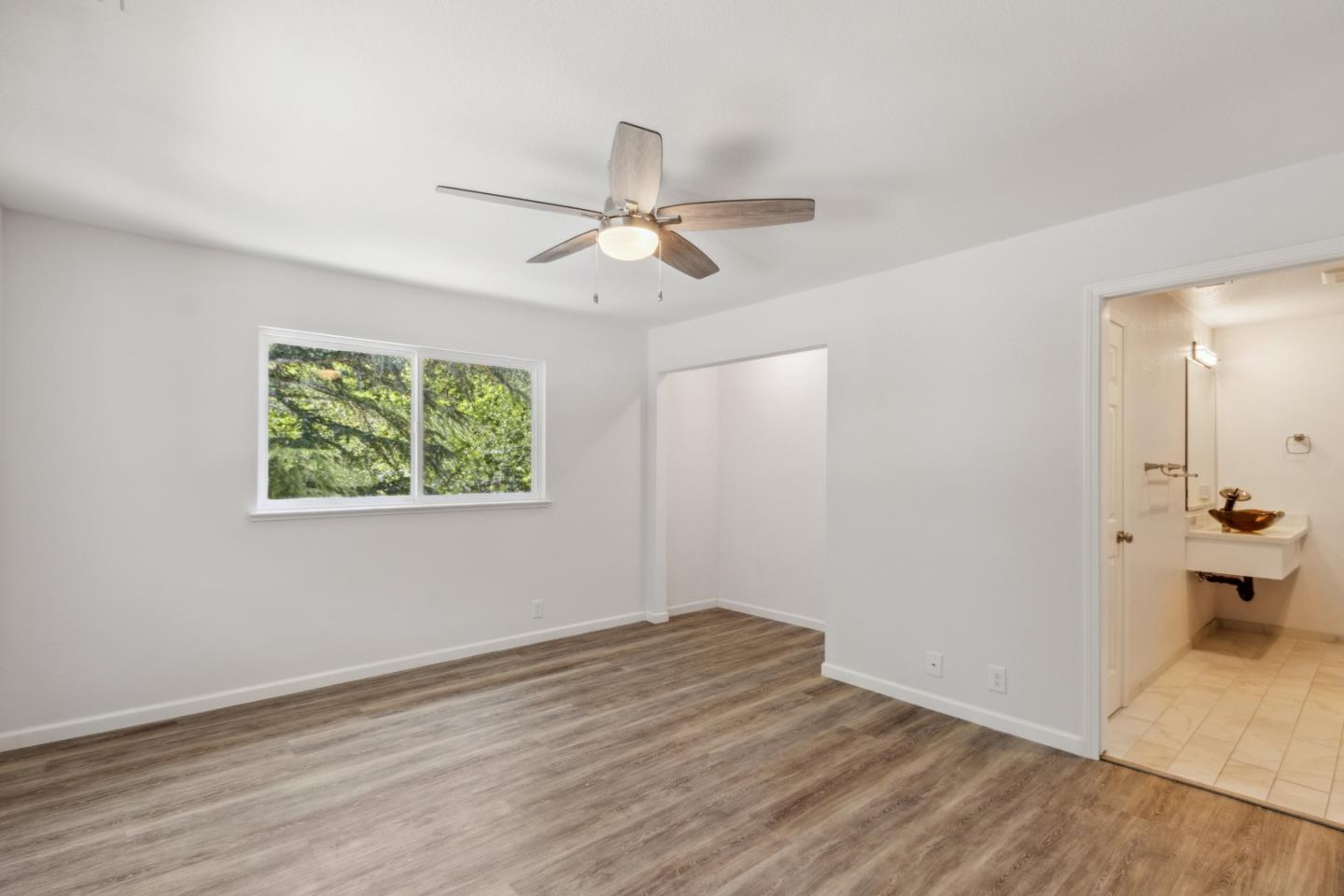 24895 Skyland Road Los Gatos, CA 95033 - Photo 24 of 113 wooden floor in an empty room with a window