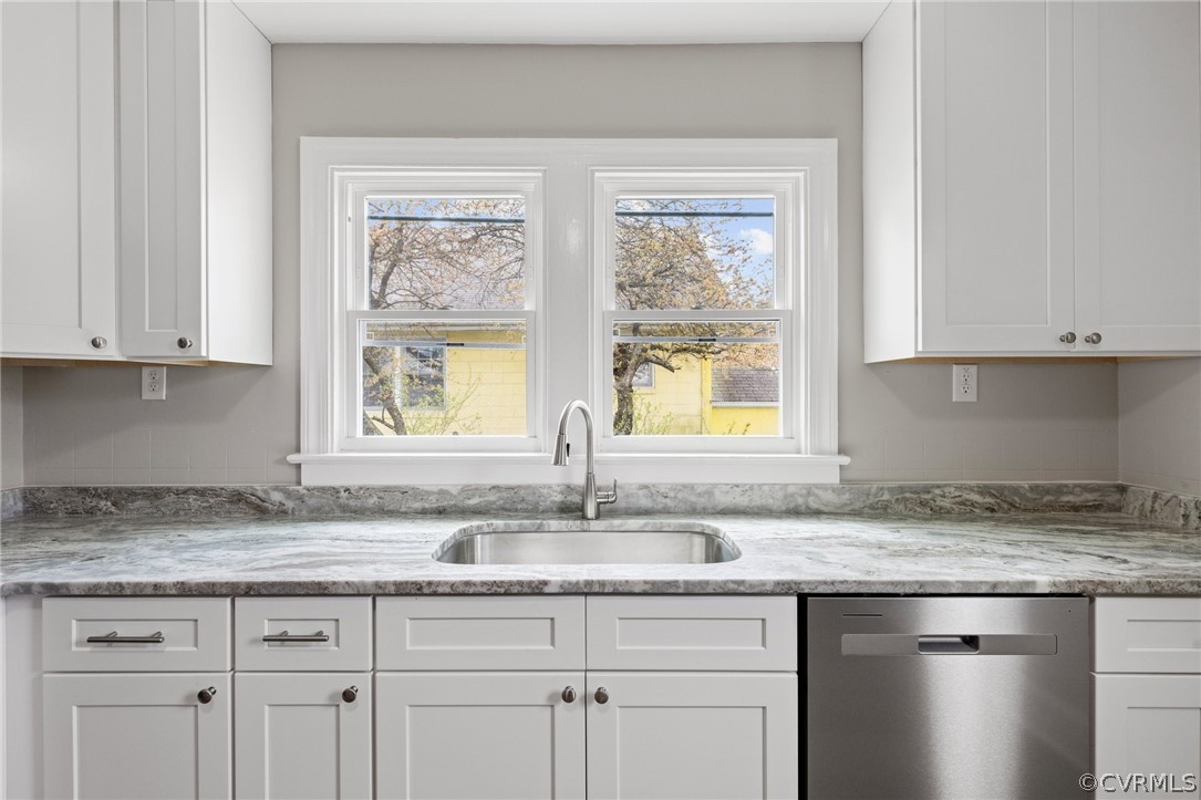 3510 East River Road Petersburg, VA 23803 - Photo 11 of 19 a kitchen with granite countertop white cabinets and a window