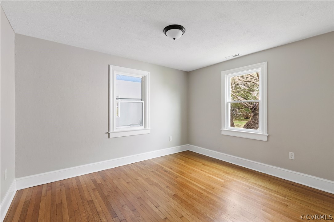 3510 East River Road Petersburg, VA 23803 - Photo 13 of 19 a view of an empty room with wooden floor and a window