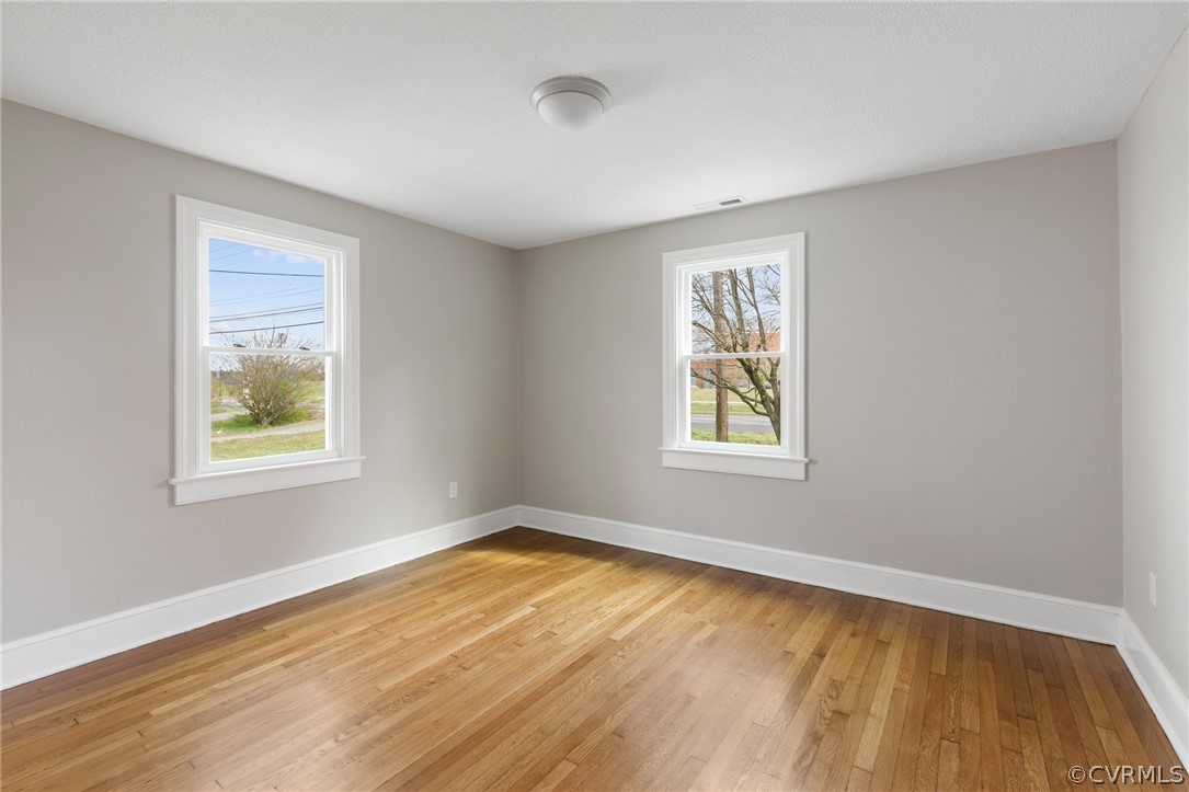 3510 East River Road Petersburg, VA 23803 - Photo 14 of 19 a view of an empty room with wooden floor and a window
