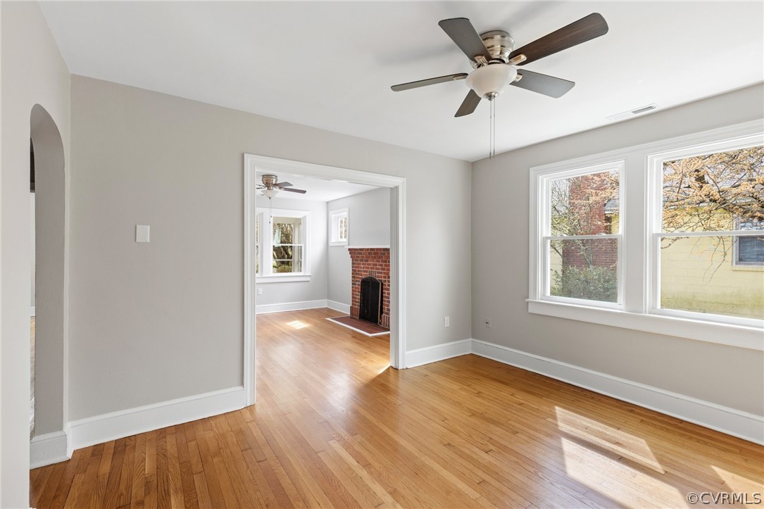 3510 East River Road Petersburg, VA 23803 - Photo 8 of 19 a view of an empty room with a window and wooden floor
