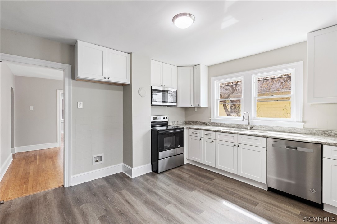 3510 East River Road Petersburg, VA 23803 - Photo 10 of 19 a kitchen with granite countertop white cabinets and white appliances