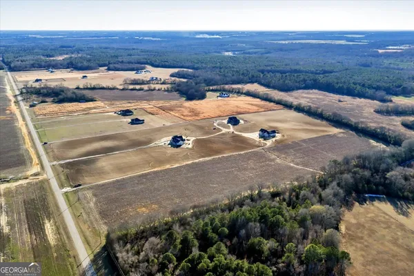 a view of a backyard with seating area
