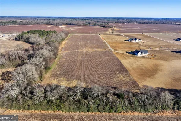 a view of a swimming pool with an outdoor space and seating area