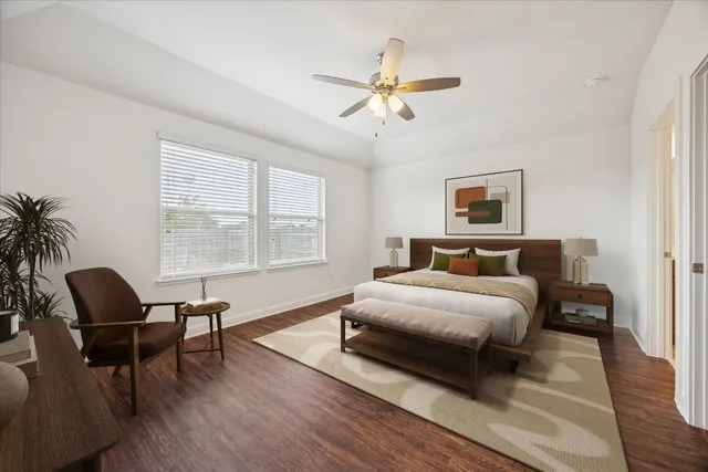 a spacious bedroom with a bed and a window