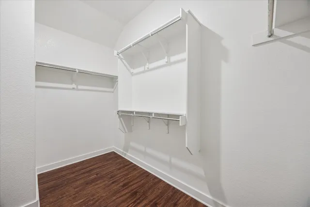 a view of an empty walk in closet