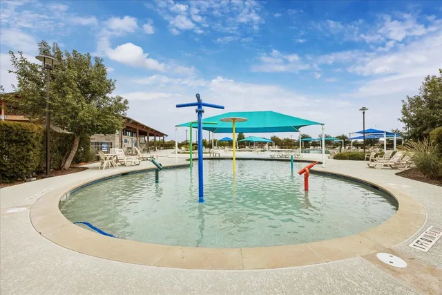 a view of a swimming pool with a patio