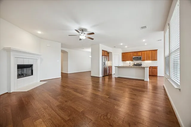 a view of a kitchen with a sink and a stove top oven