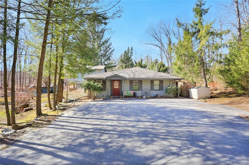 2 Holiday Point Road Sherman, CT 06784 - Photo 1 of 1 a front view of a house with a yard