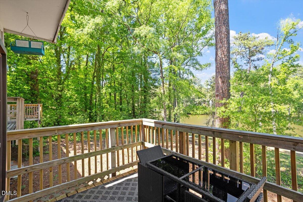 5045 Tall Pines Court Raleigh, NC 27609 - Photo 34 of 37 a view of a balcony with wooden floor