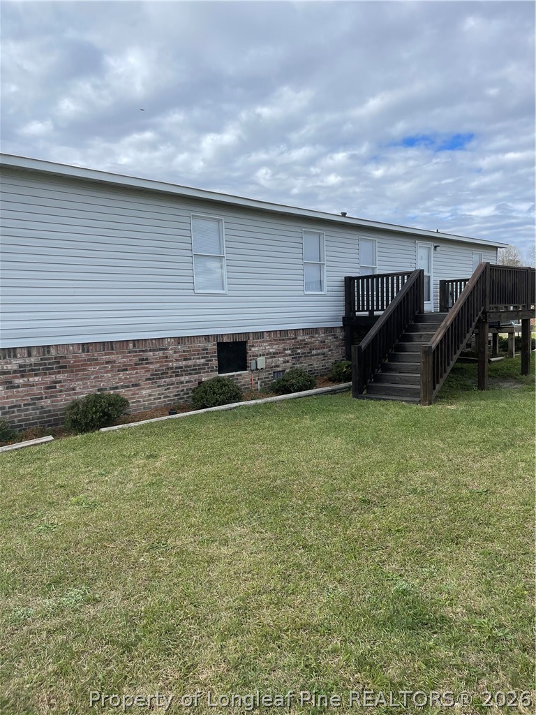 152 Three Bridges Road Rowland, NC 28383 - Photo 4 of 27 a backyard of a house