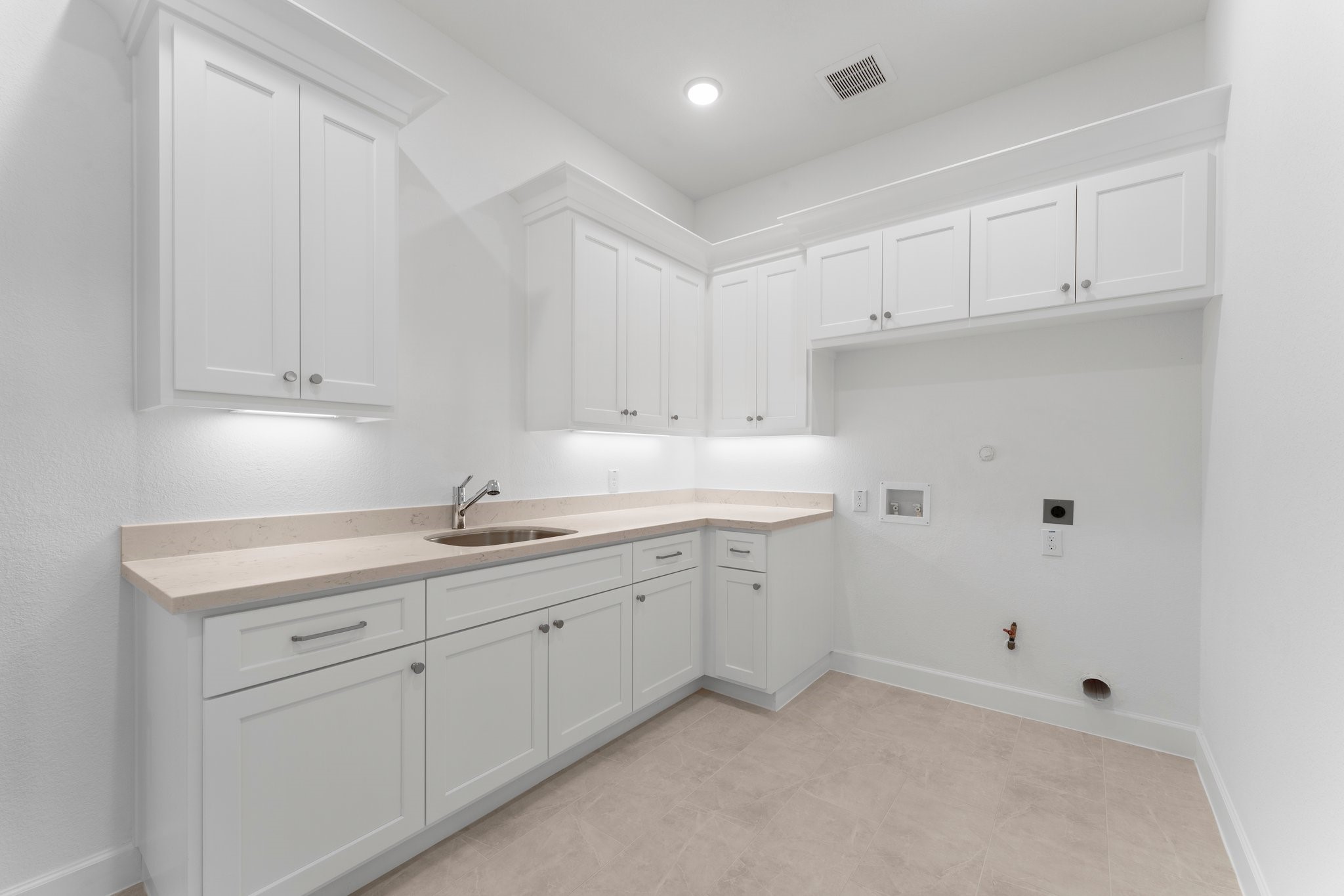 24807 Pacific Dunes Lane Spring, TX 77389 - Photo 14 of 50 a kitchen with white cabinets and sink